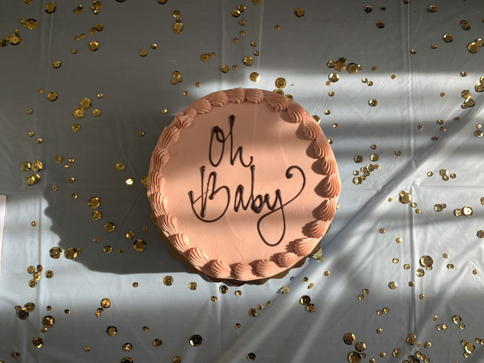 A cake that says oh baby on it