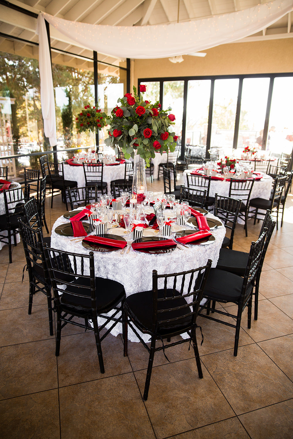 red roses with black chairs