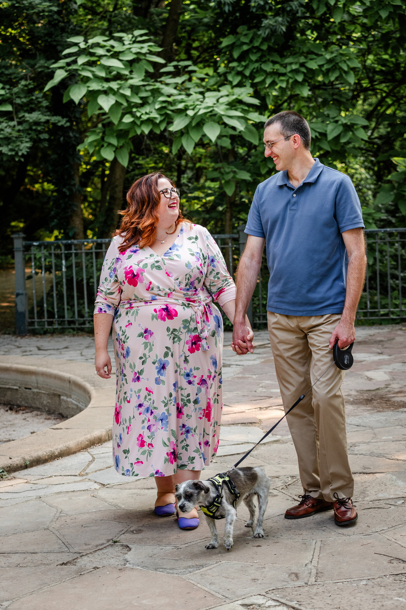 Couple walking dog