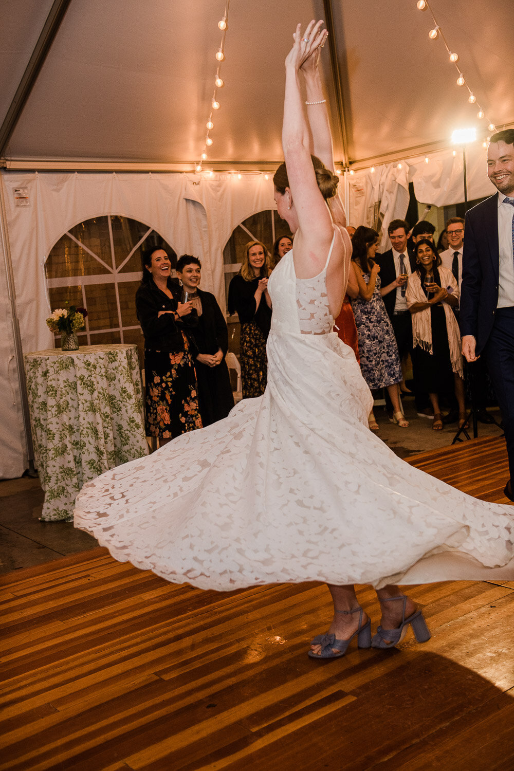 bride dancing with dress flaring out