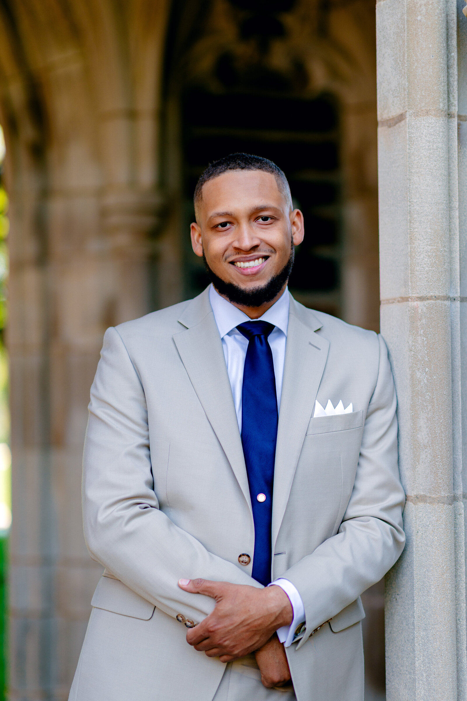 Man smiling in suit with tie for professional photo