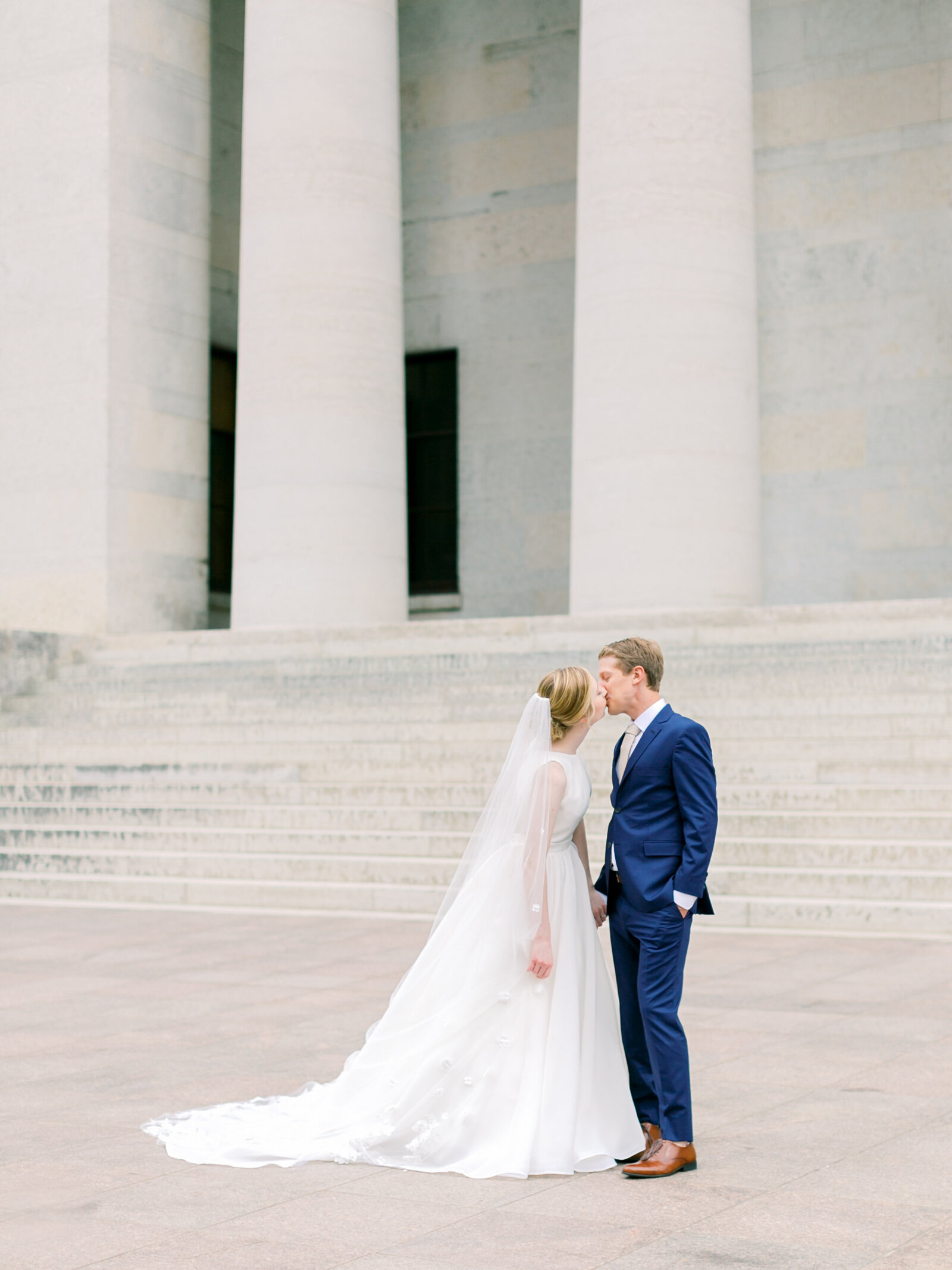 couple kissing in front of columbus state house  wedding
