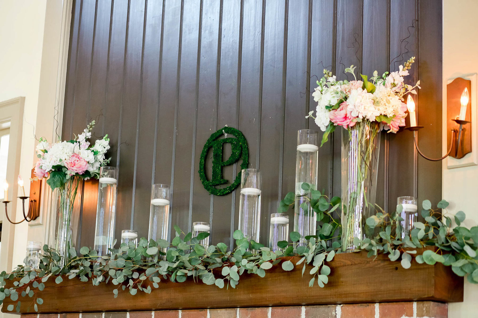 Flowers and candles are arranged on the mantle, I'ON Creek Club, Mt Pleasant, South Carolina