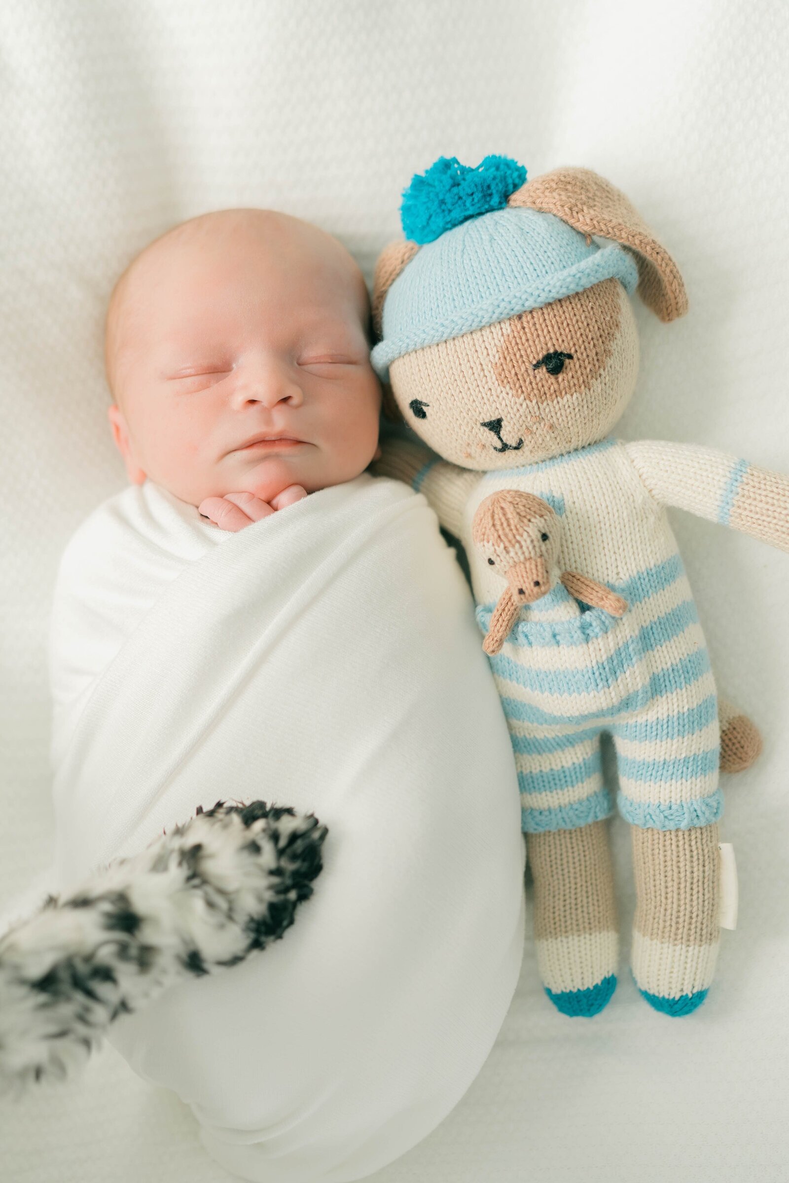 At-home newborn photography session in Holladay, Utah, captured by Salt Lake City newborn photographer Iris Graciela. Natural light and natural photography style highlighting intimate moments with baby and family.