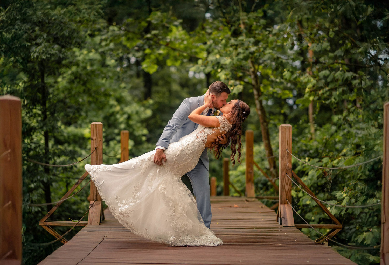 Married couples kiss in the bridge