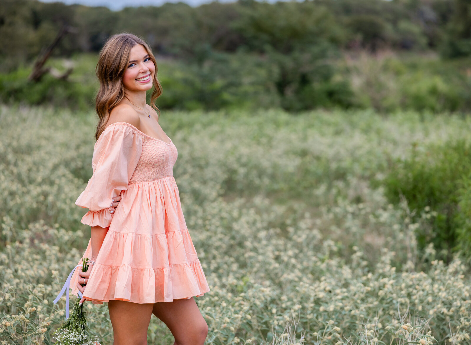 senior girl in flower field
