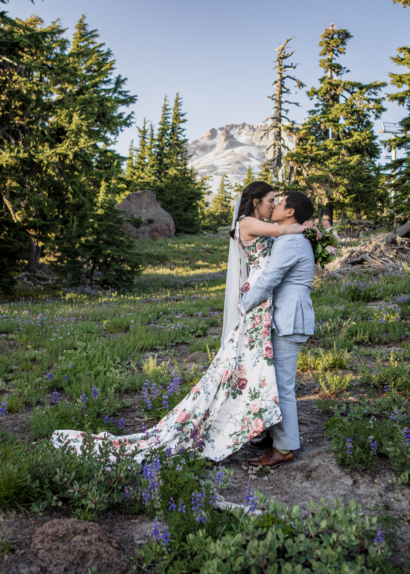 Couple laughing together during their elopement up at Timberline on Mount Hood