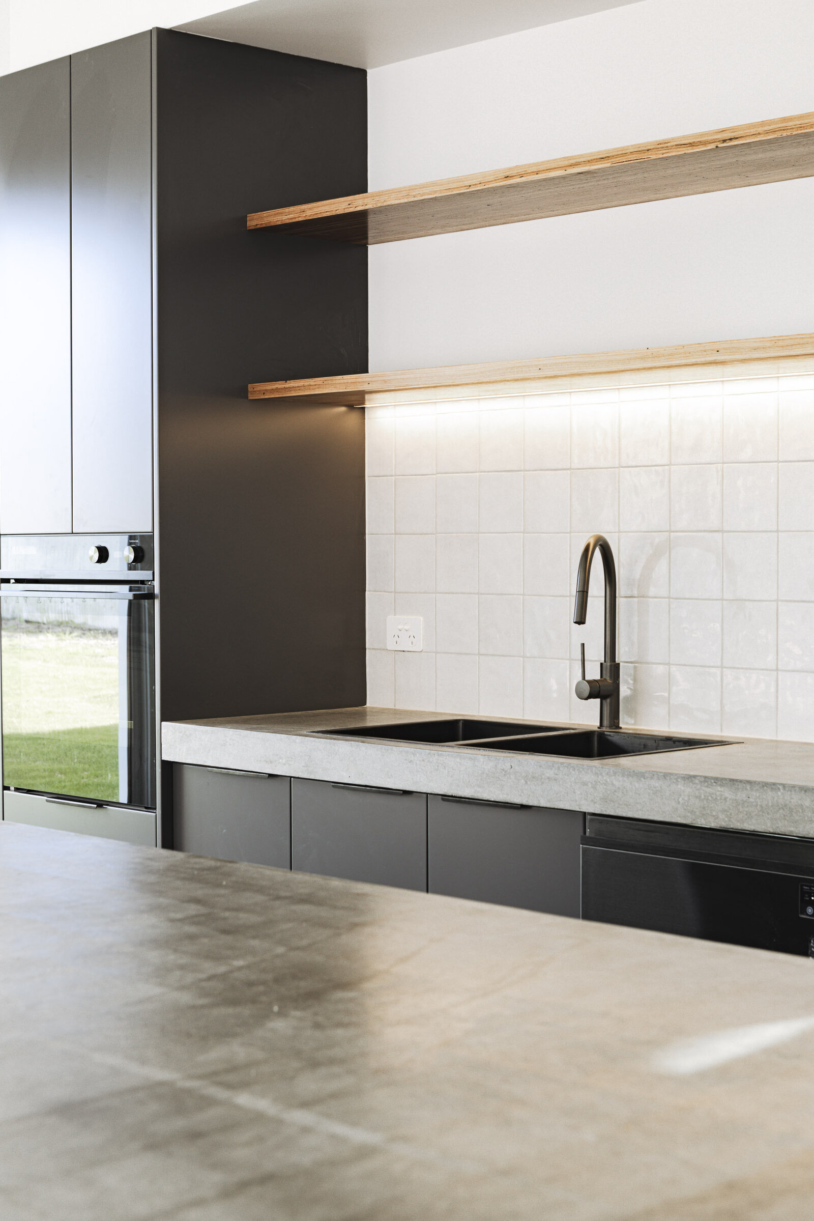 Sleek kitchen design with concrete benchtops