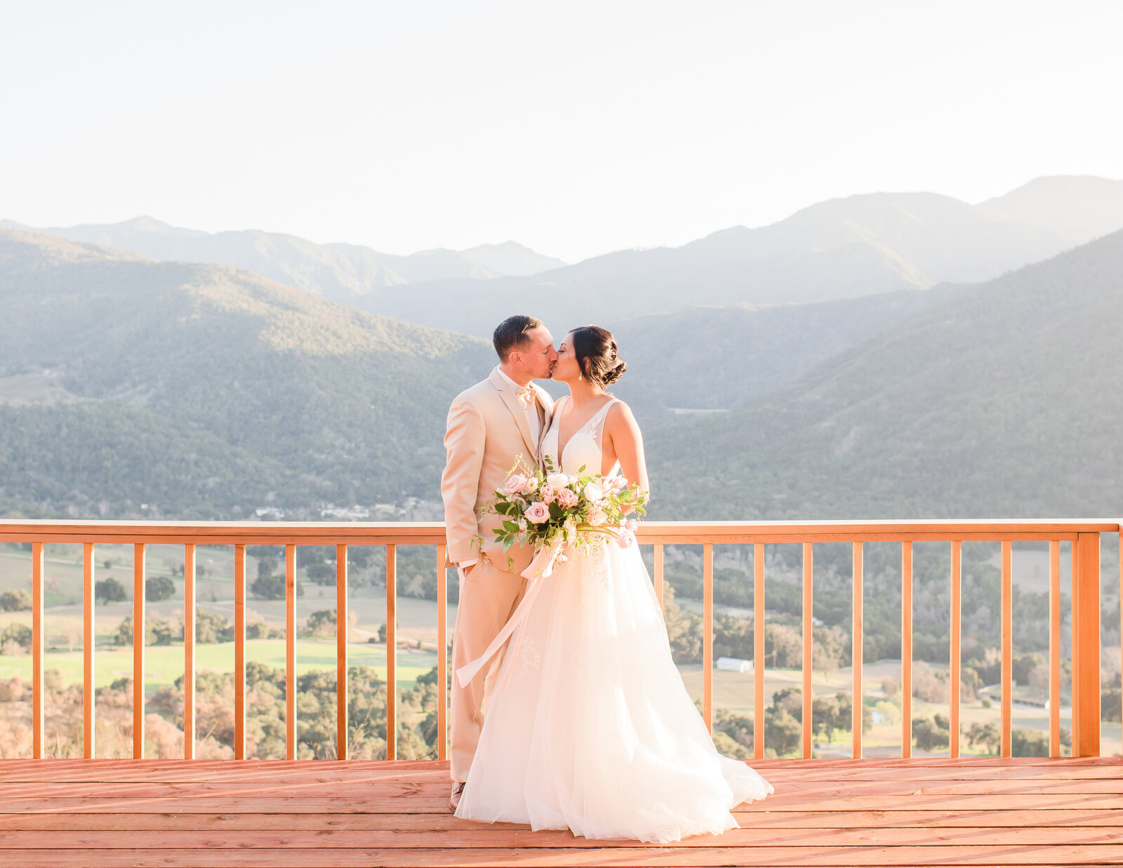 wedding-couple-on-patio-overlooking-vineyeard-2
