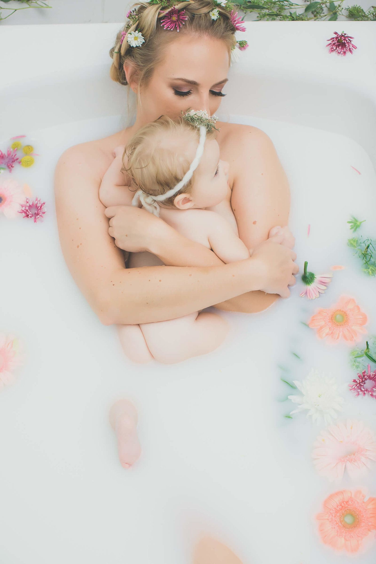 mommy and child milkbath session with flowers