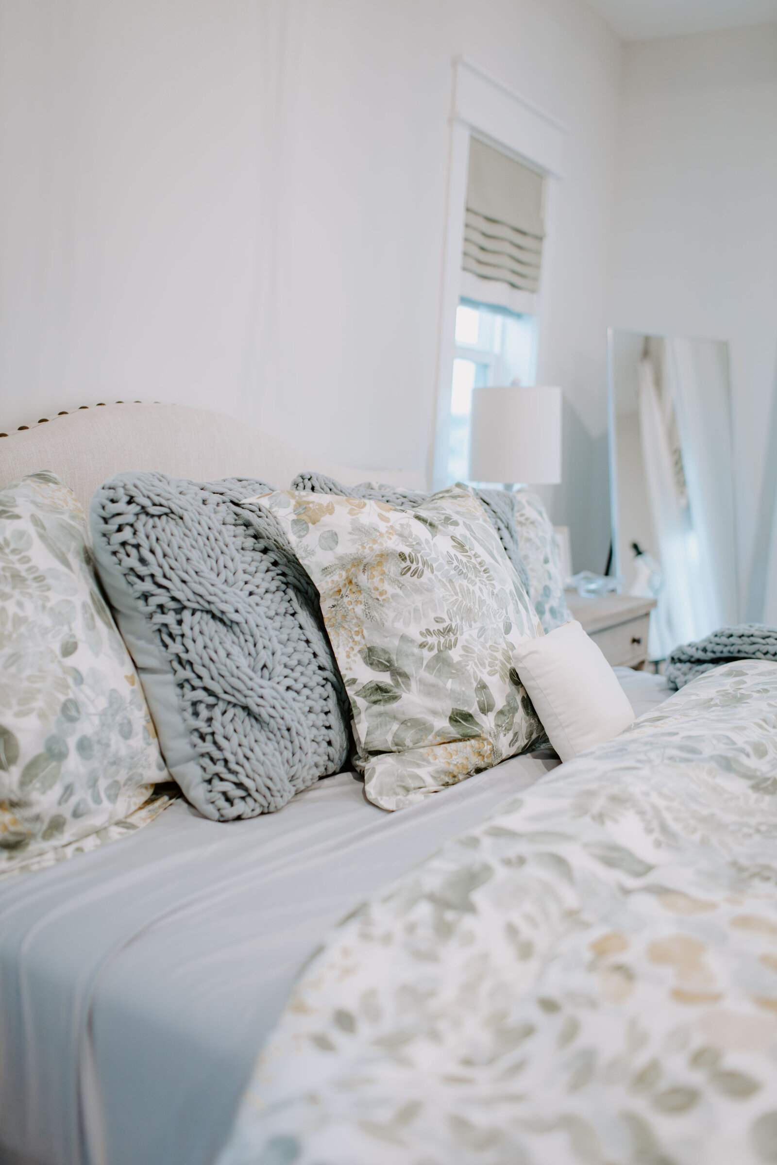 Peaceful bedroom retreat with calming colors, luxury linens, and custom furnishings by Holling Home Interiors.