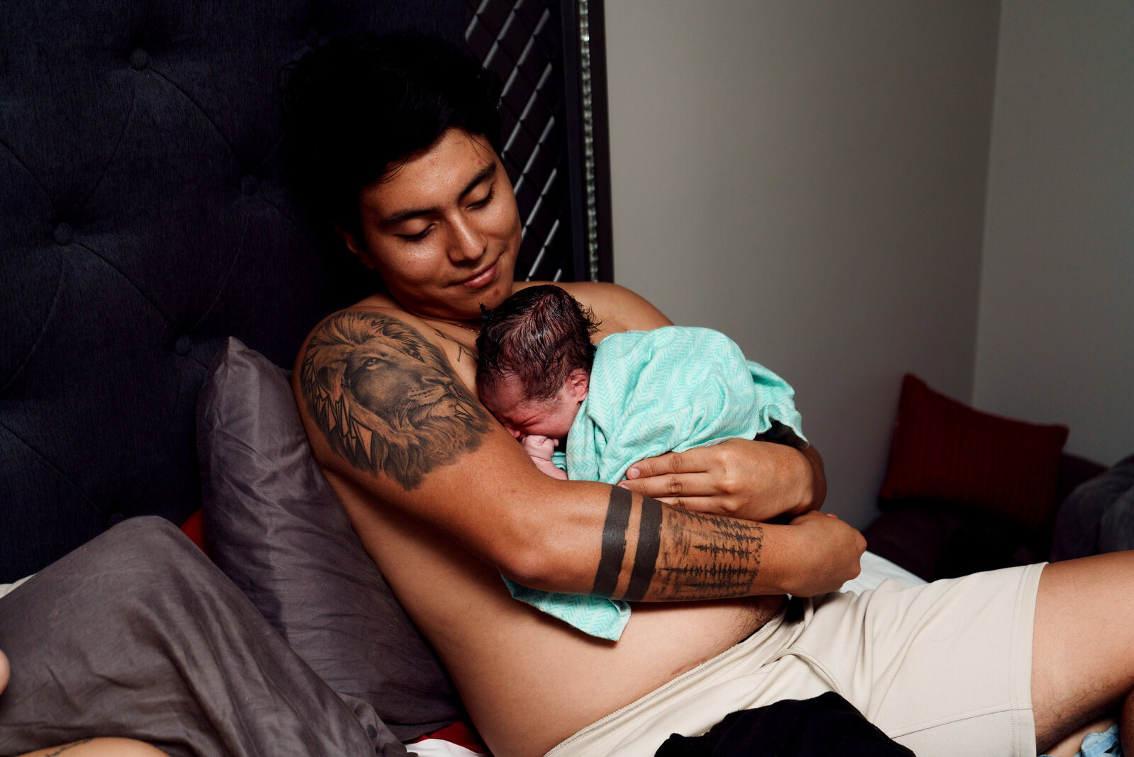 Father holding newborn after a birth in Boynton Beach, FL