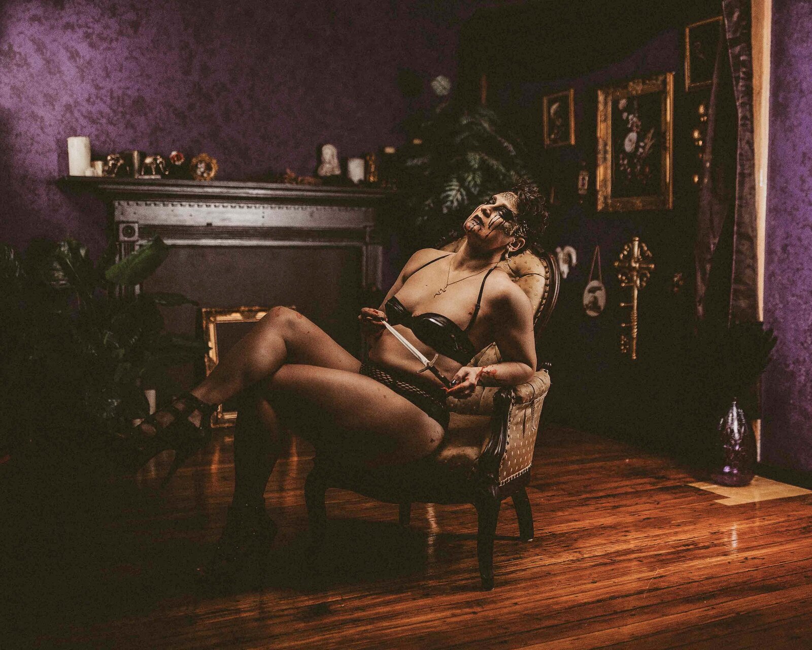 scary looking woman sitting on a couch