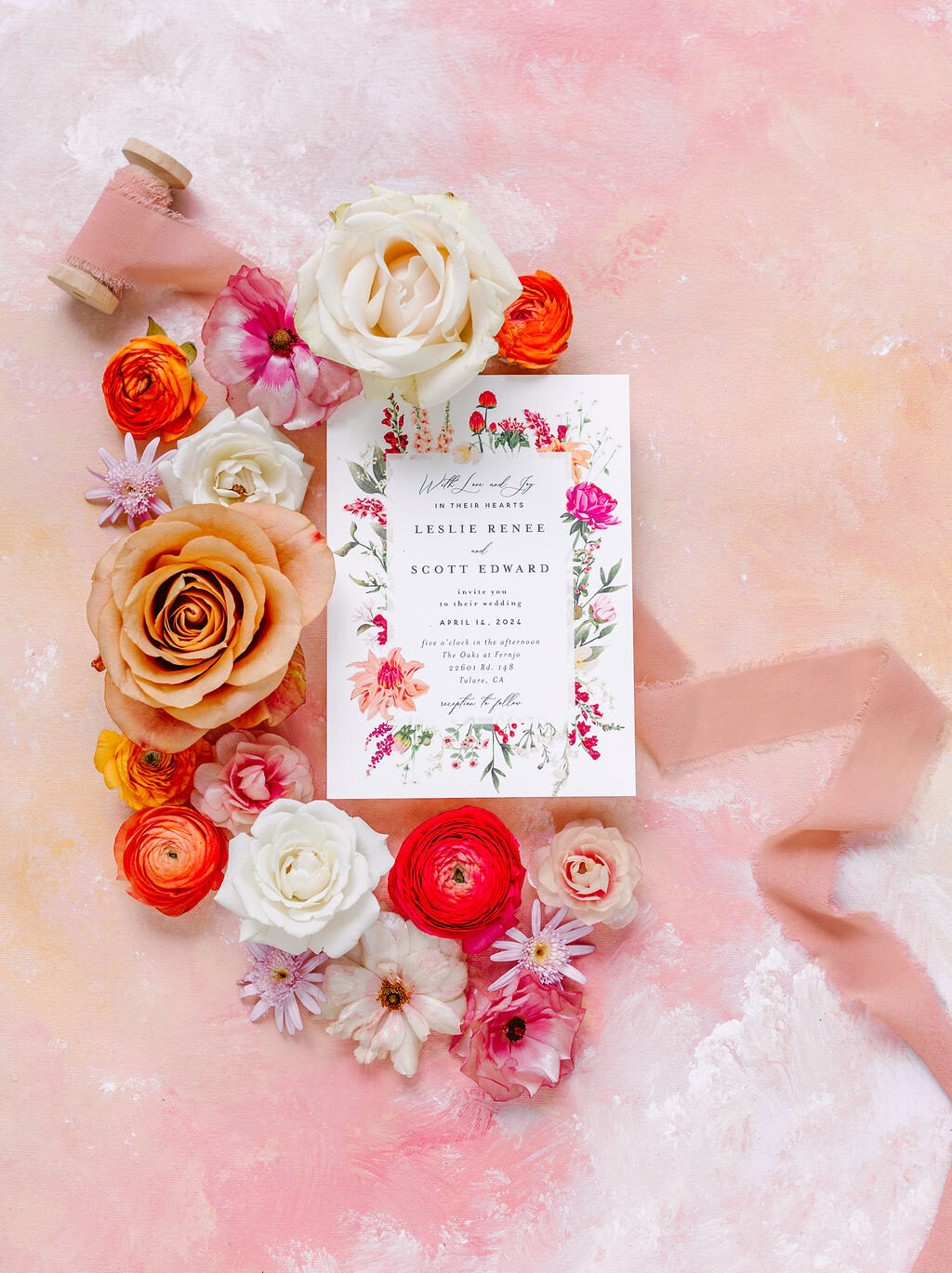 Colorful flatlay with with Minted invitation and style board
