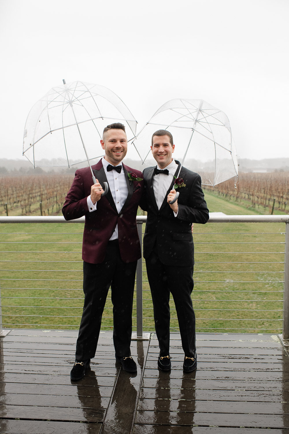 groom formal with umbrellas outside on ceck
