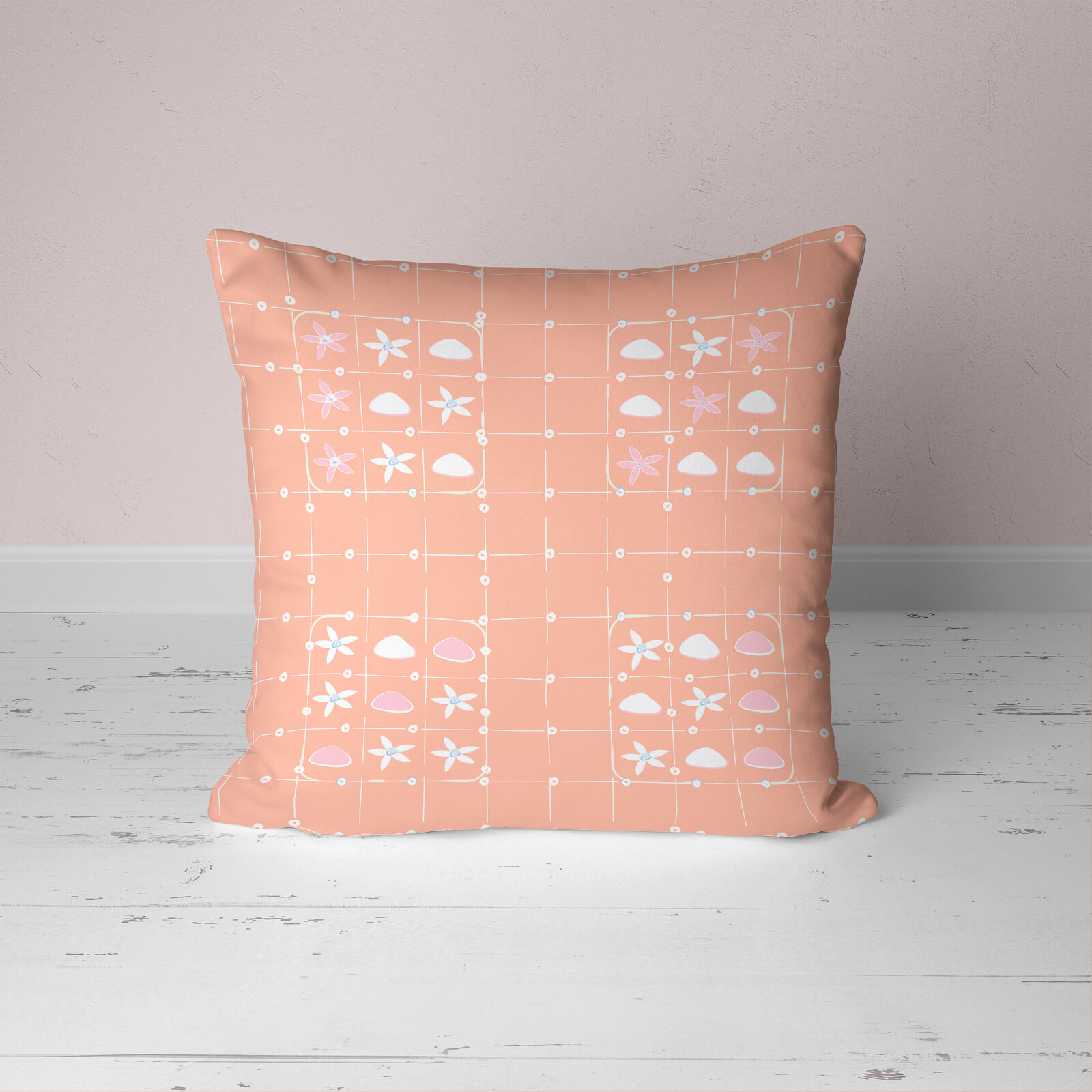 Coral and white patterned pillow