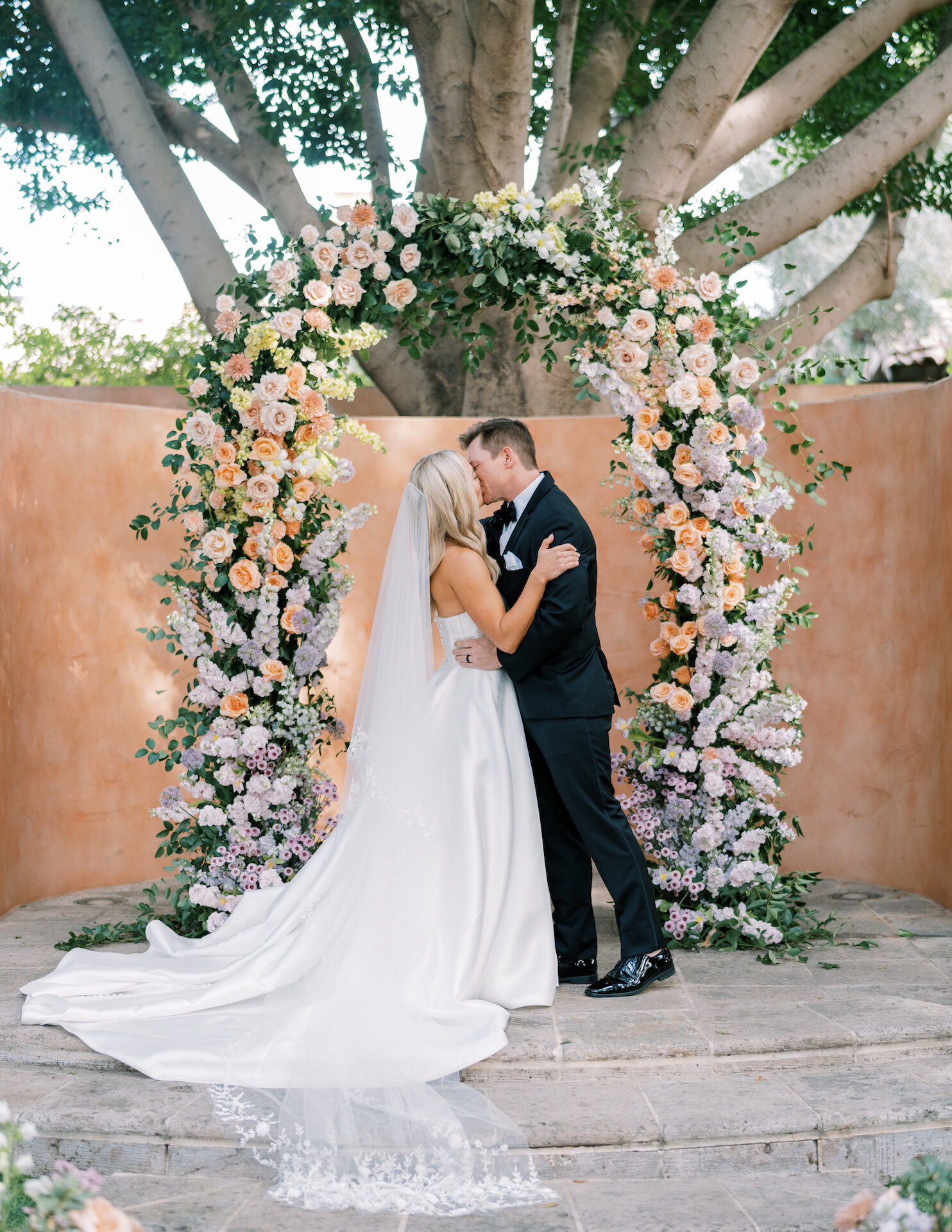 bride-groom-wedding-ceremony-arch-flowers-greenery-scottsdale-florist