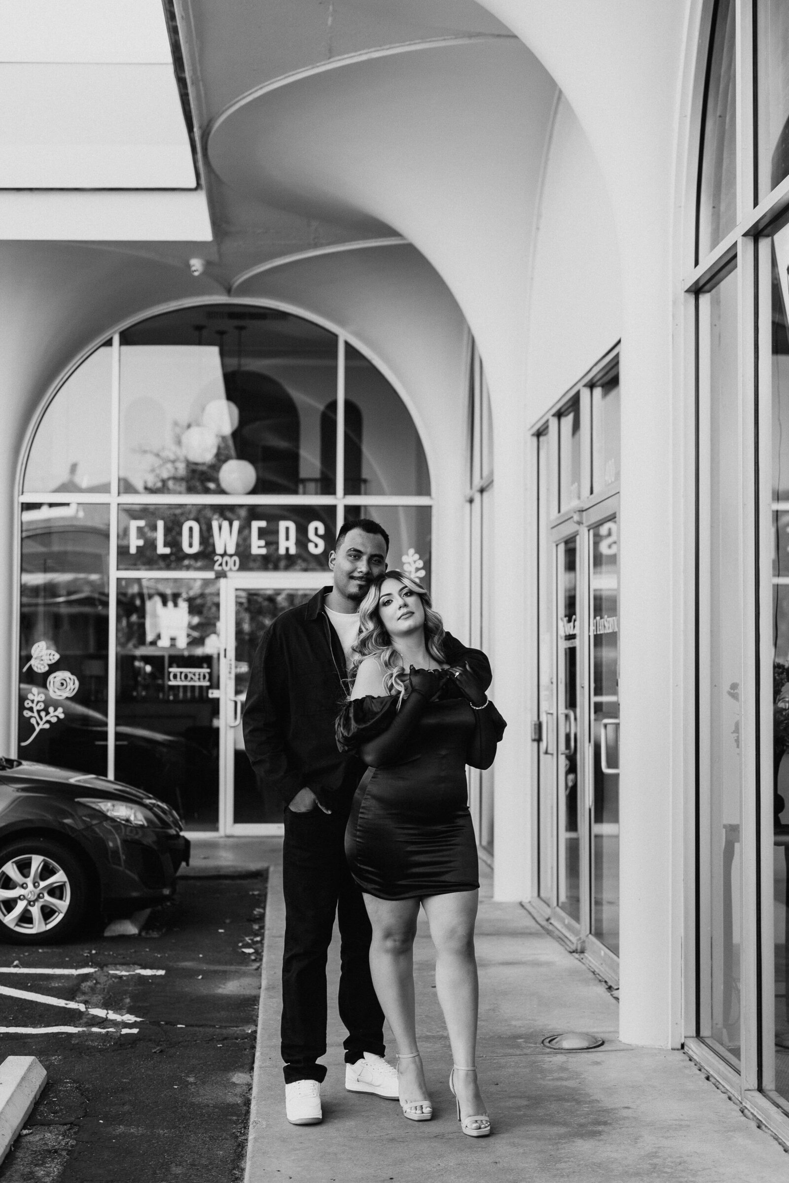 Couple wearing all black during classy engagement session in Downtown Wichita  - Alex Bo Photo