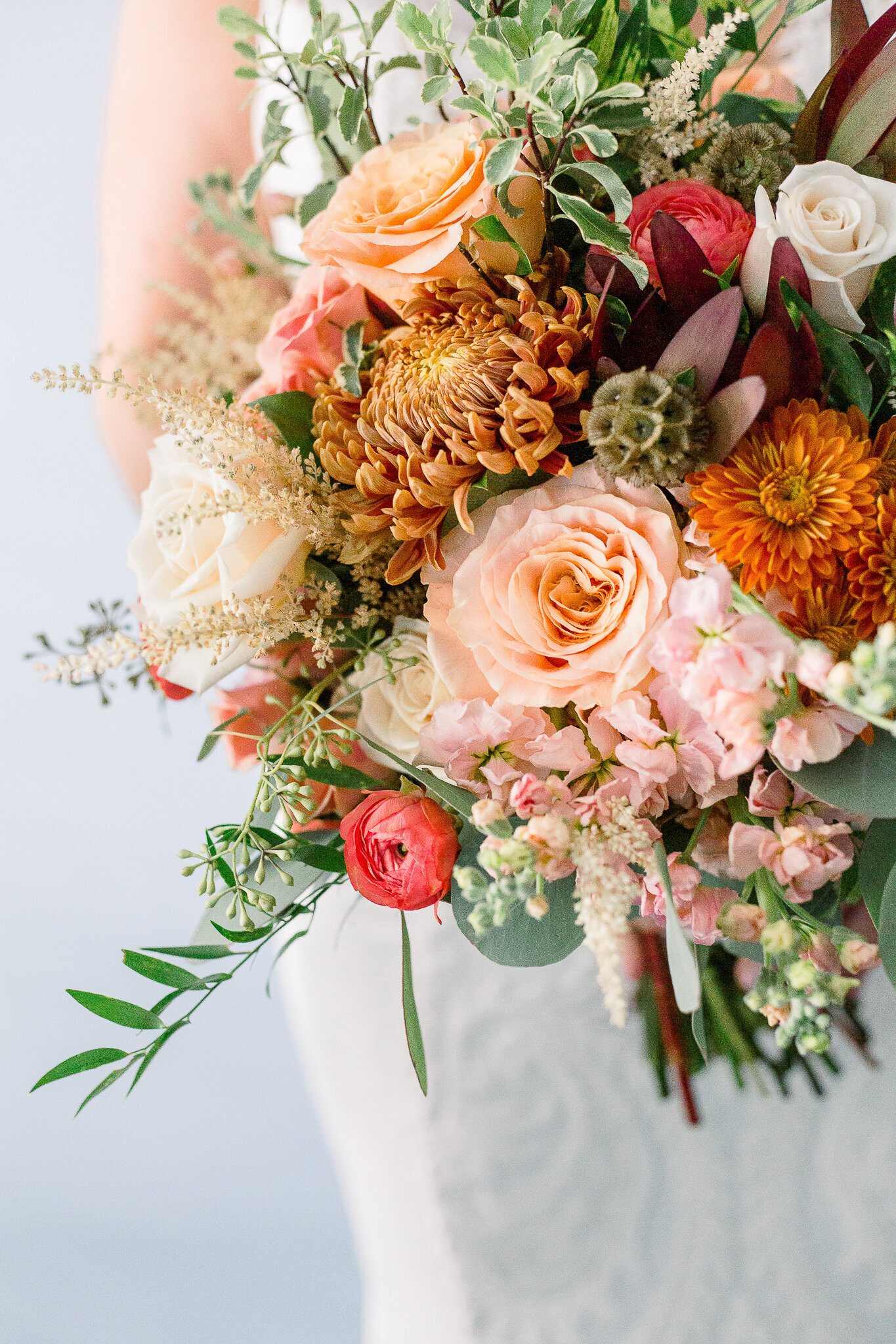 A pink and orange spring wedding bouquet