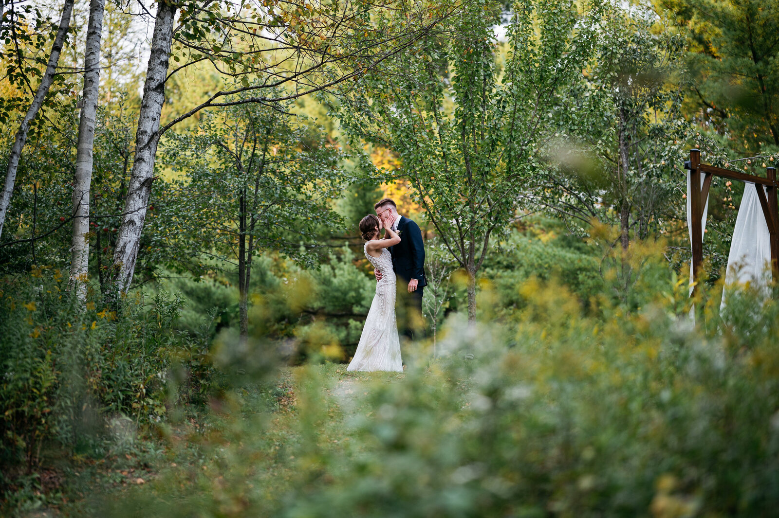bride-groom-portrait-kissing-woods-magical-elegant
