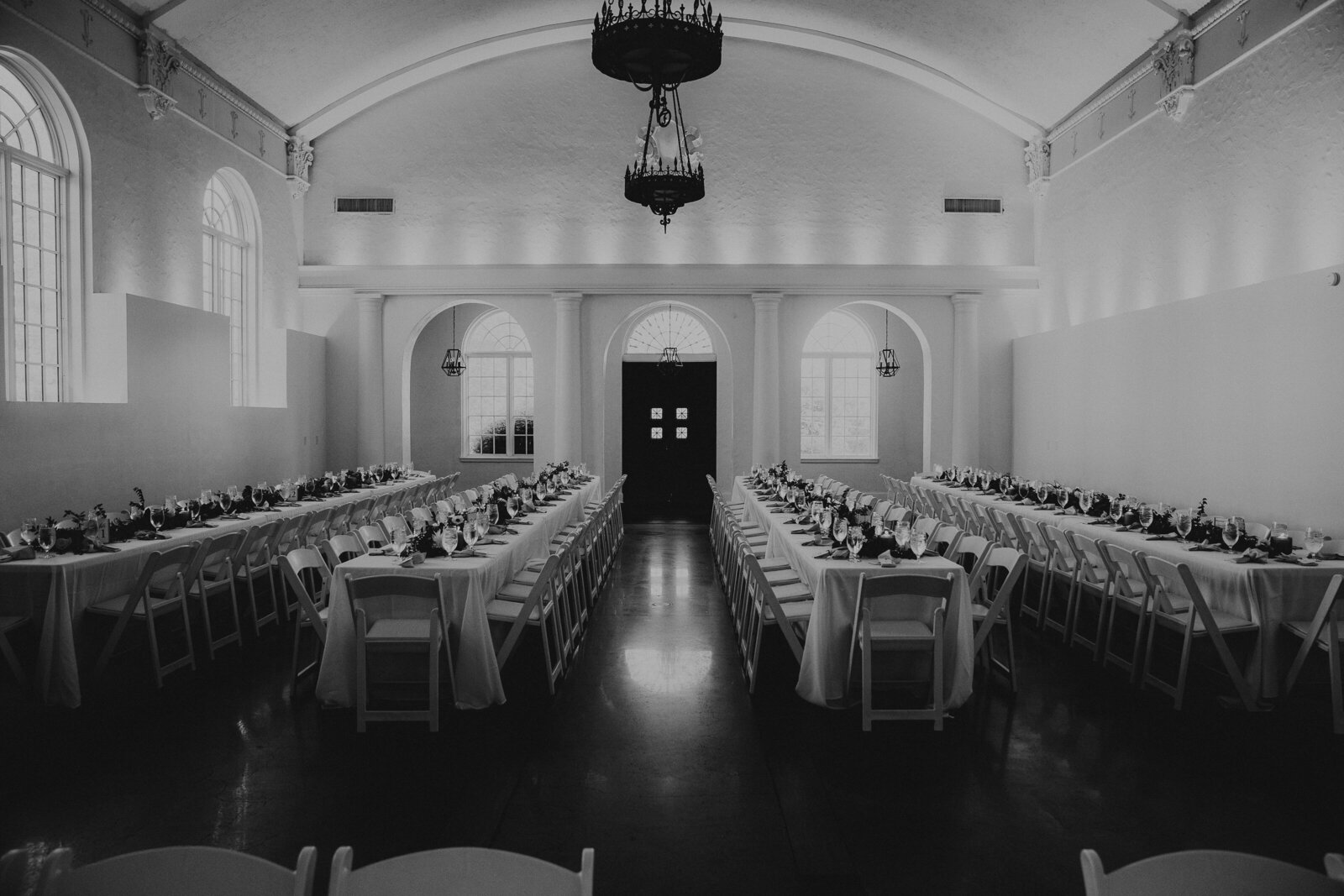 Black and white photo of a wedding reception setup at La Villa KC in Kansas City