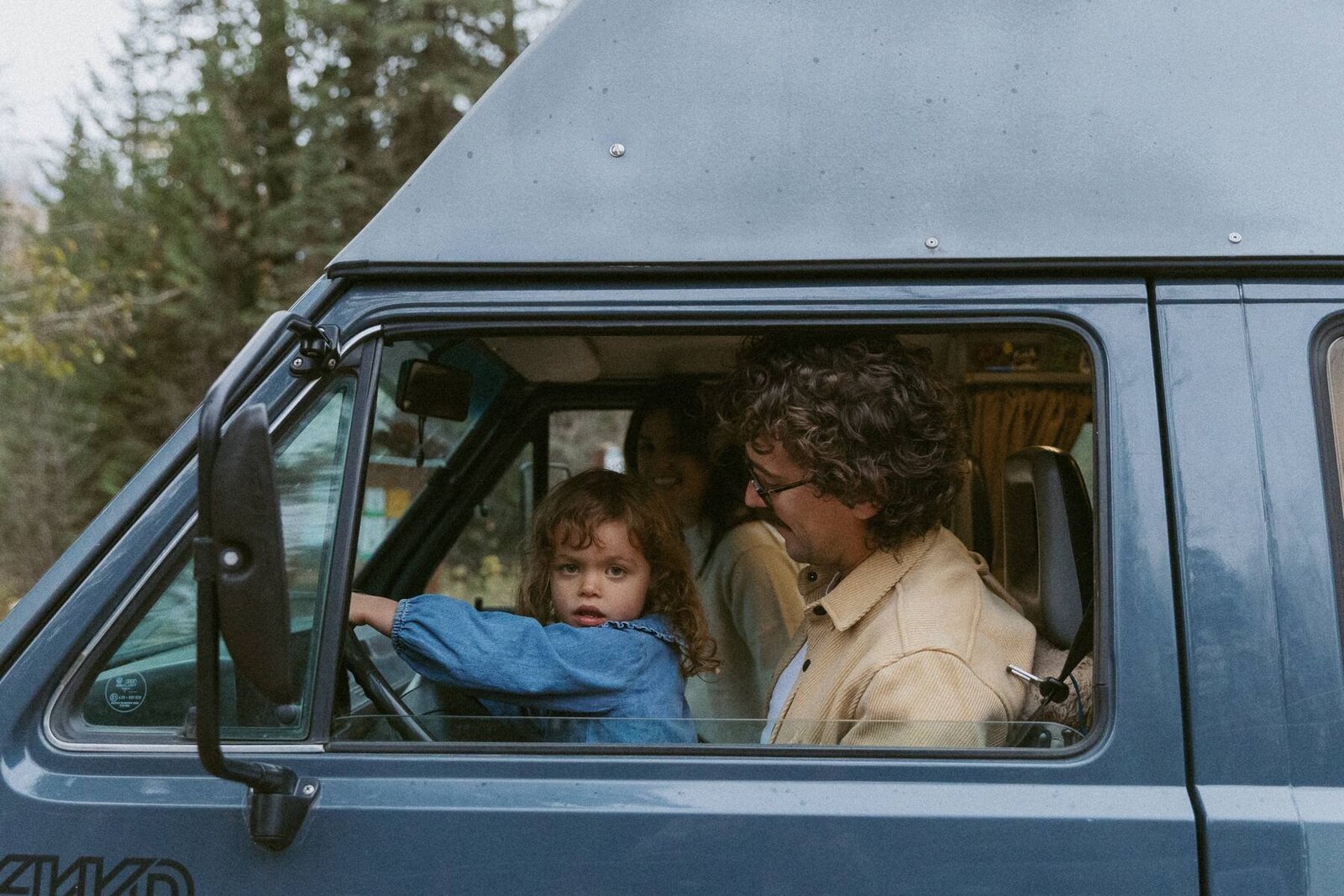 fernie family sits in their volkswagen van when being captured by fernie photographer