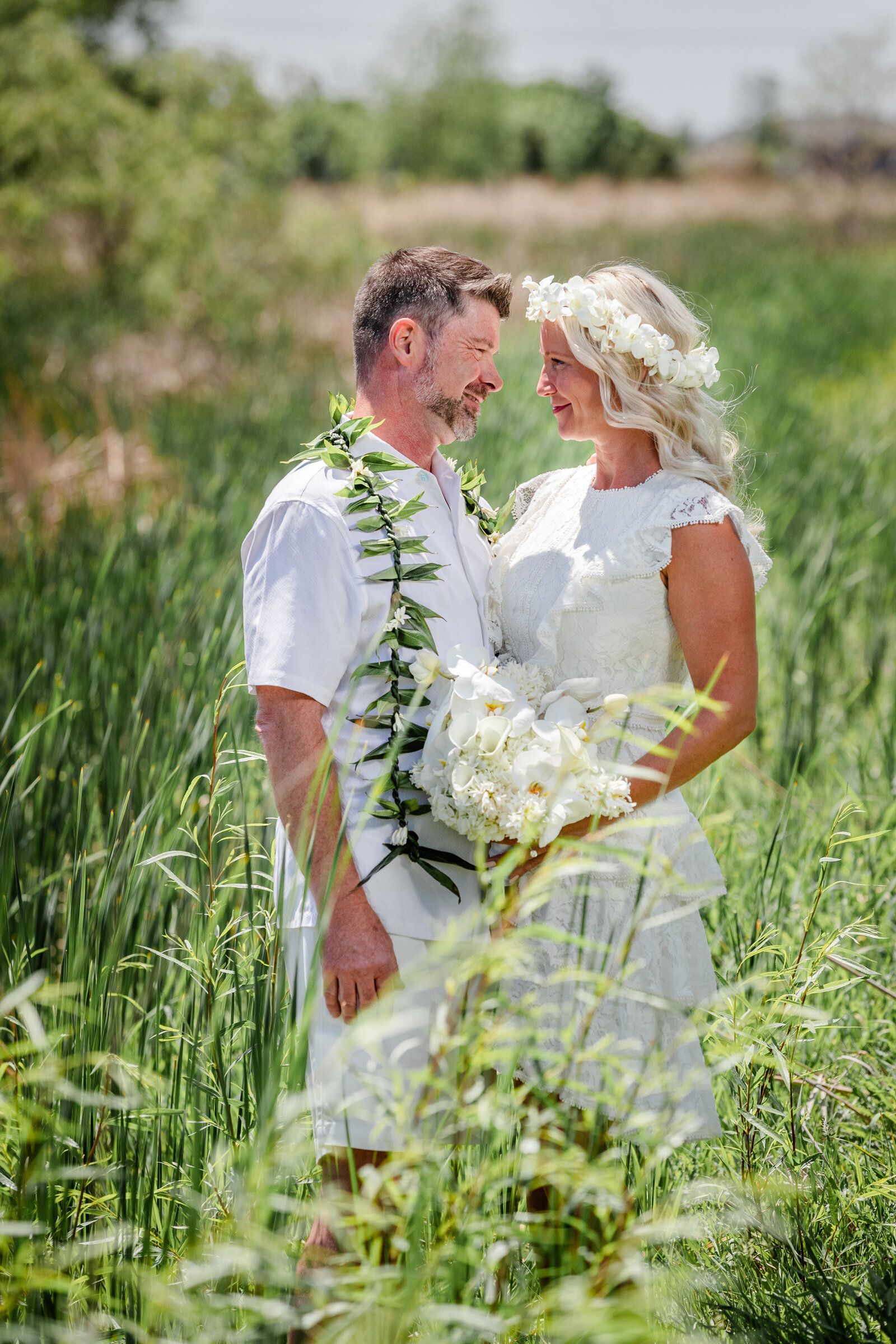 Bride and Groom in tall grass