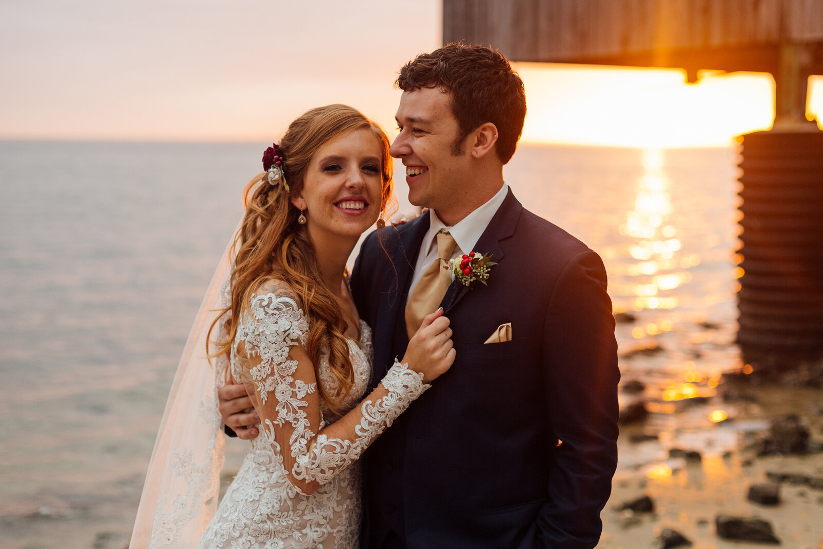 bride-and-groom-at-beach-basking-in-sunset-photo-iris-and-urchin-ryey