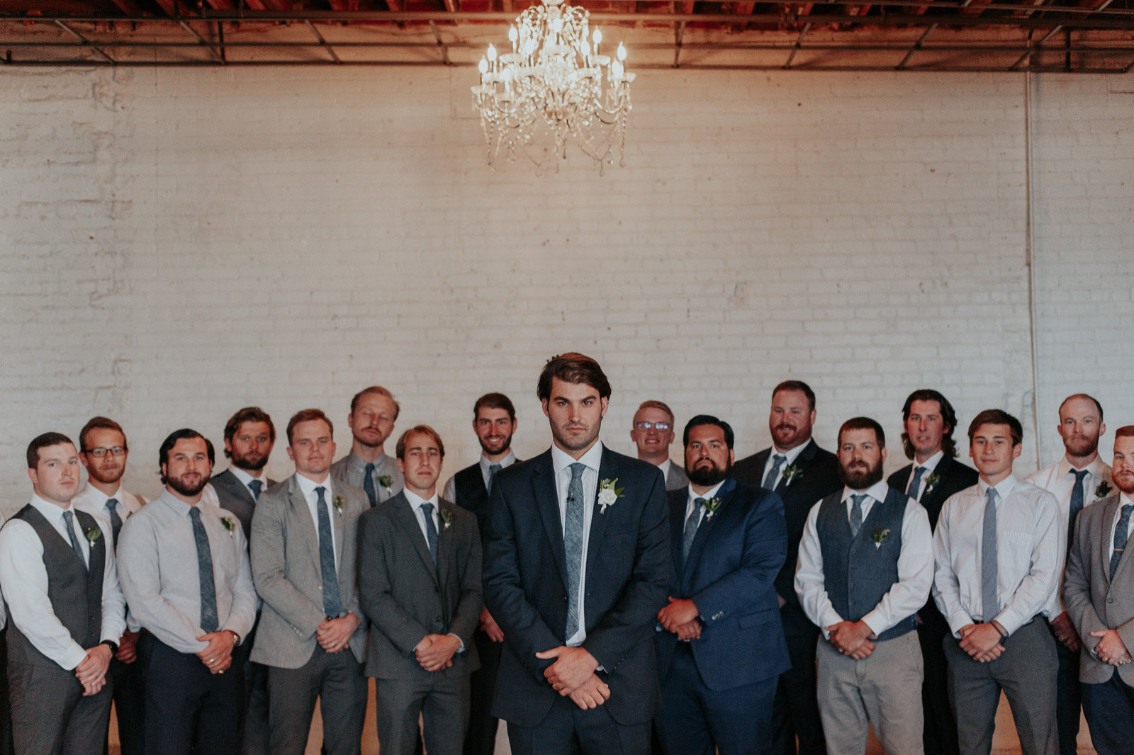awesome photo of groom with his groomsmen behind him