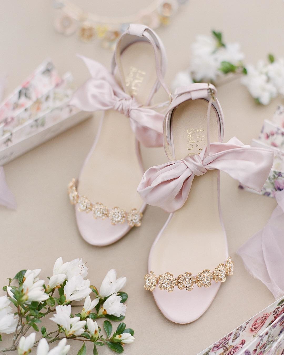 Pink silk bridal heels from Bella Belle Shoes with a romantic bow and floral embellished straps