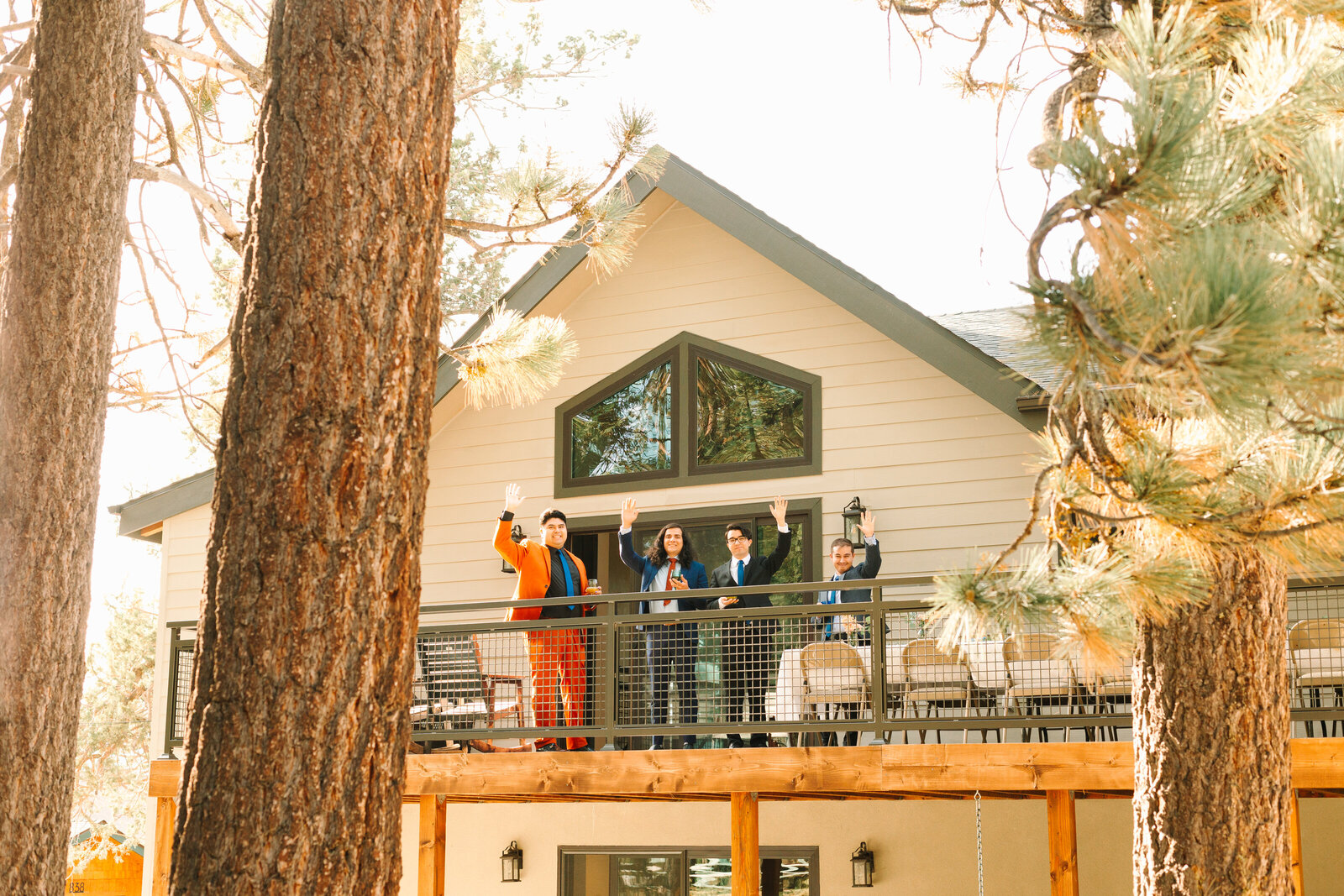 The bridal party celebrates an intimate elopement at a cabin at Big Bear Lake, California.