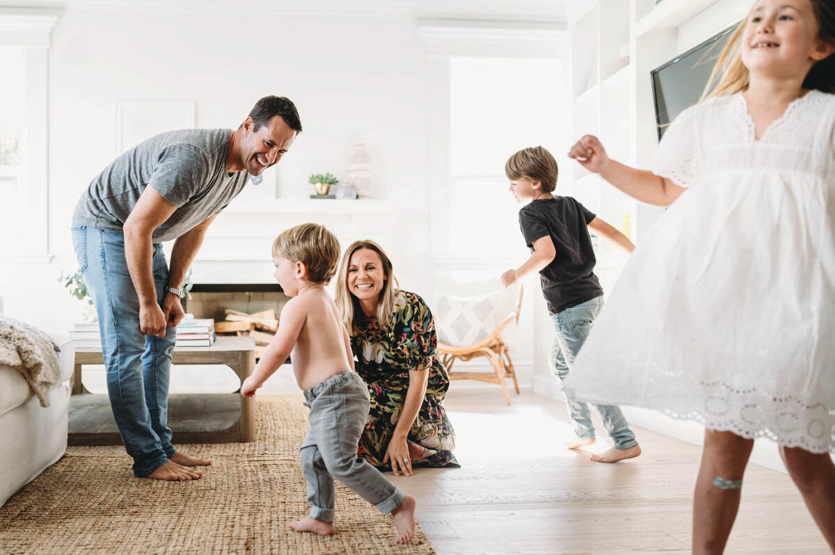 family dancing in their mclean, va living room