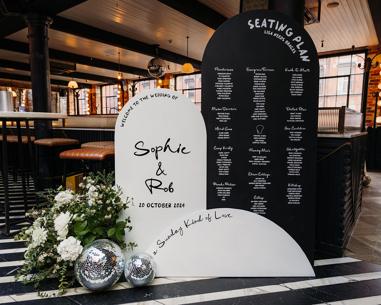 Black and white chic wedding seating chart sign at Roberta’s in Dublin, Ireland