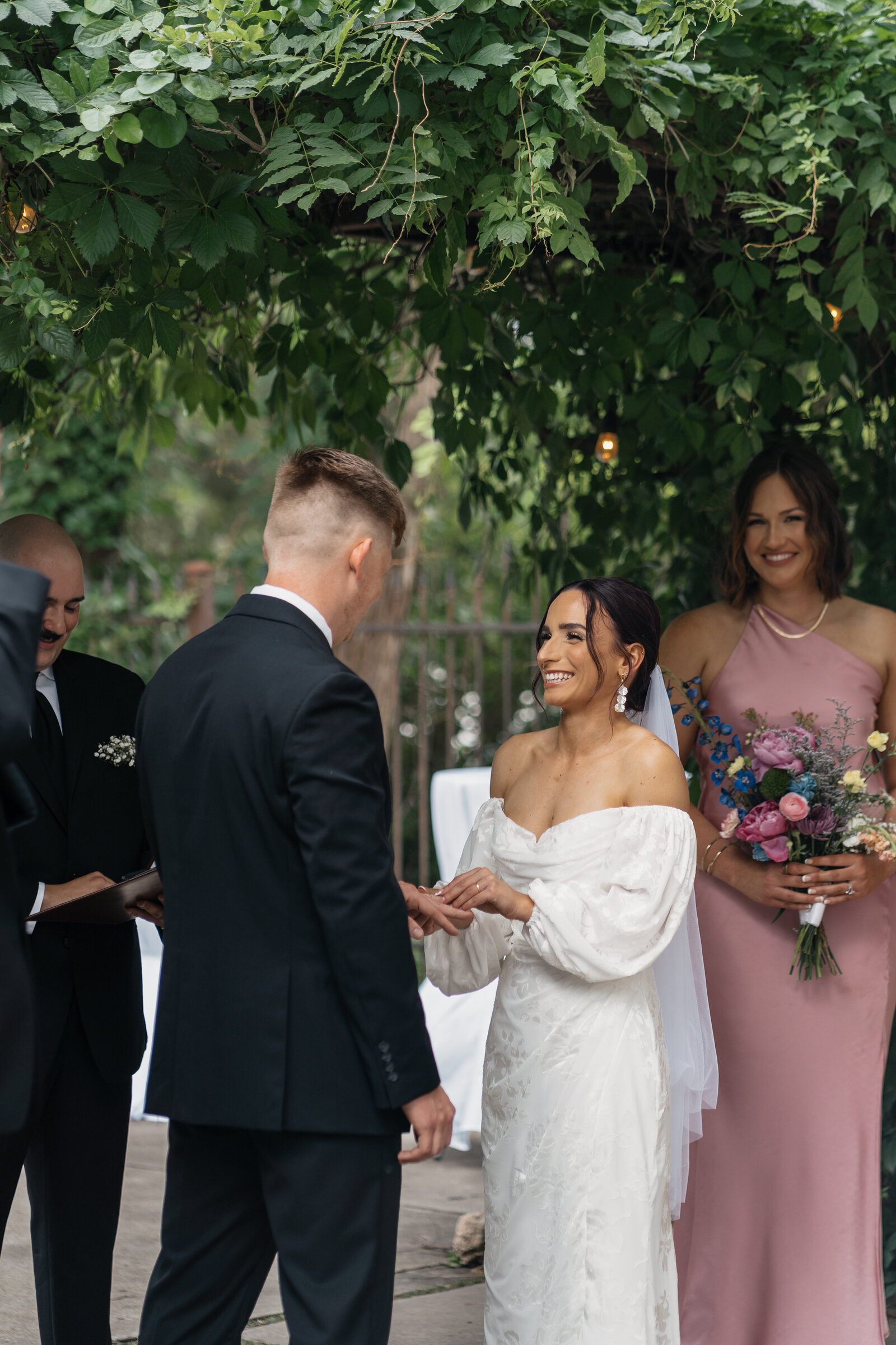 Bride and groom celebrating their intimate wedding in Lake Como, Italy, with stunning mountain views.