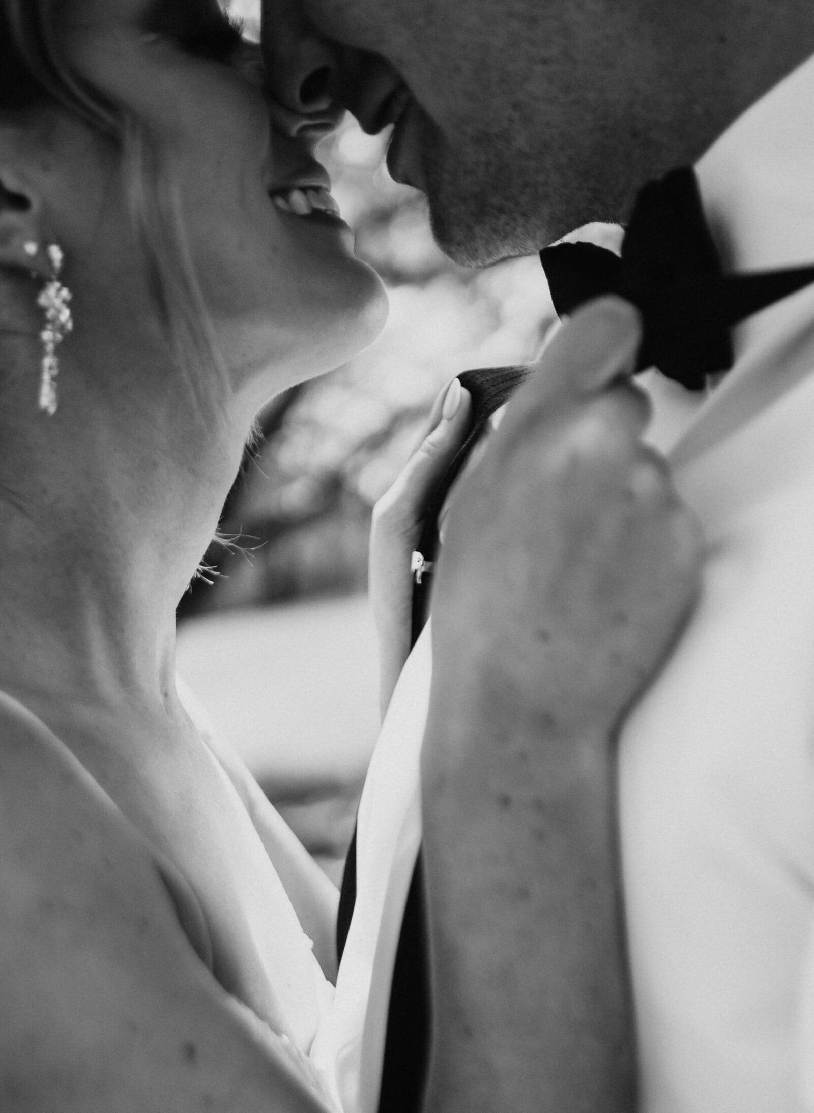 bride-holds-bowtie-home