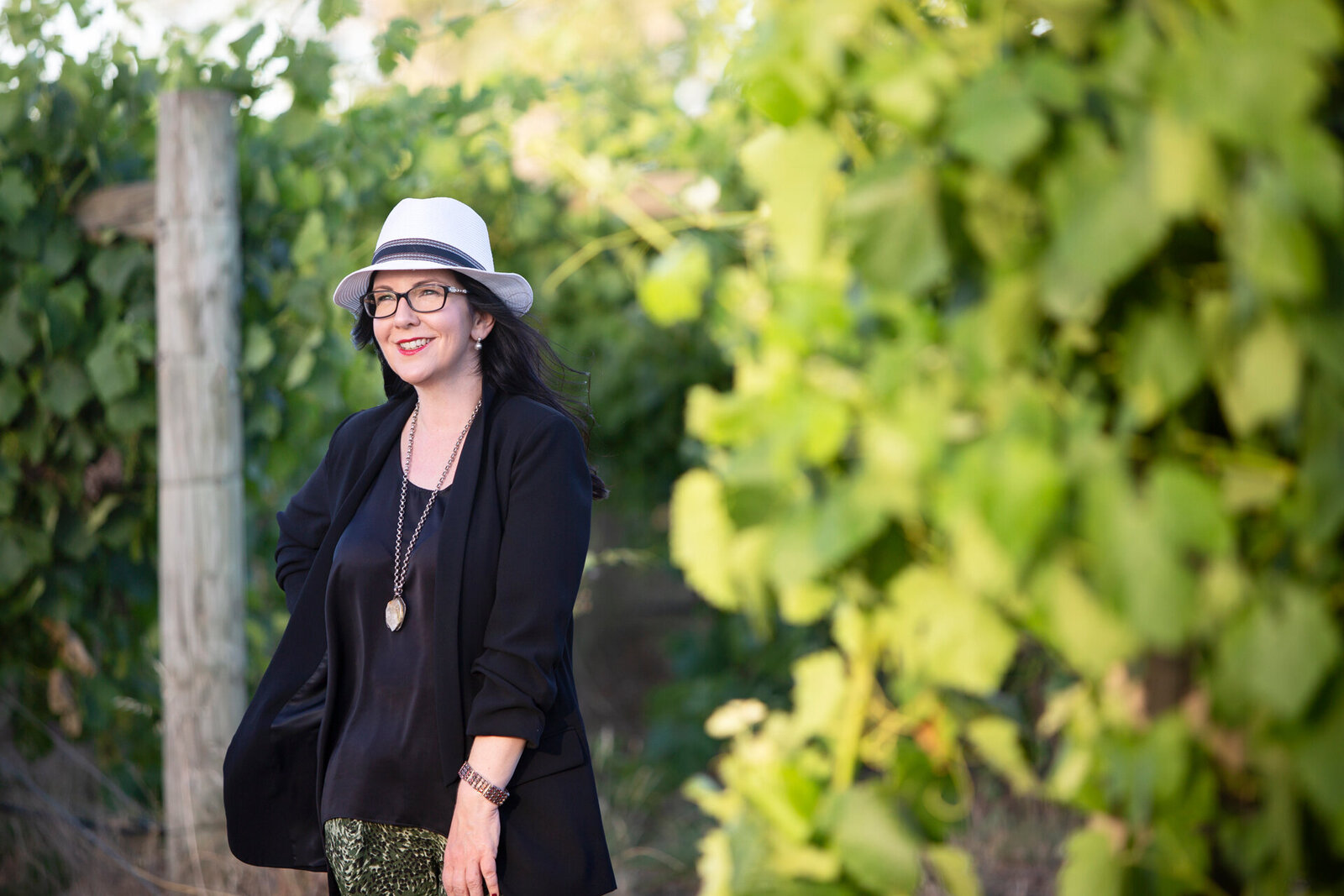 lady standing in a vineyard