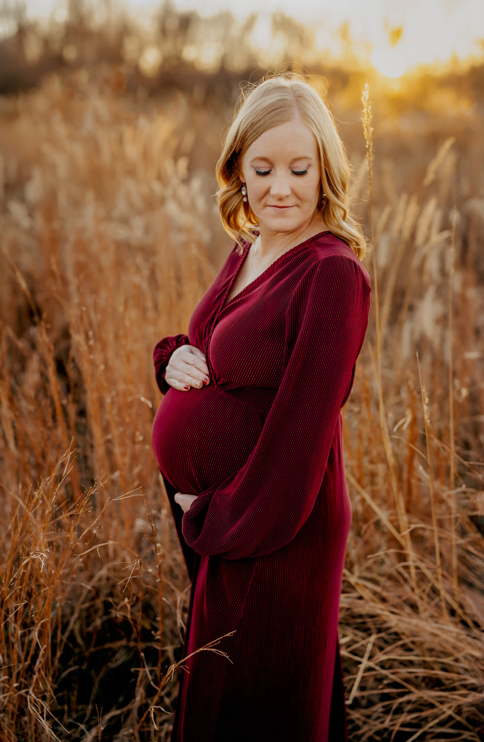 mom standing in a field pregnant