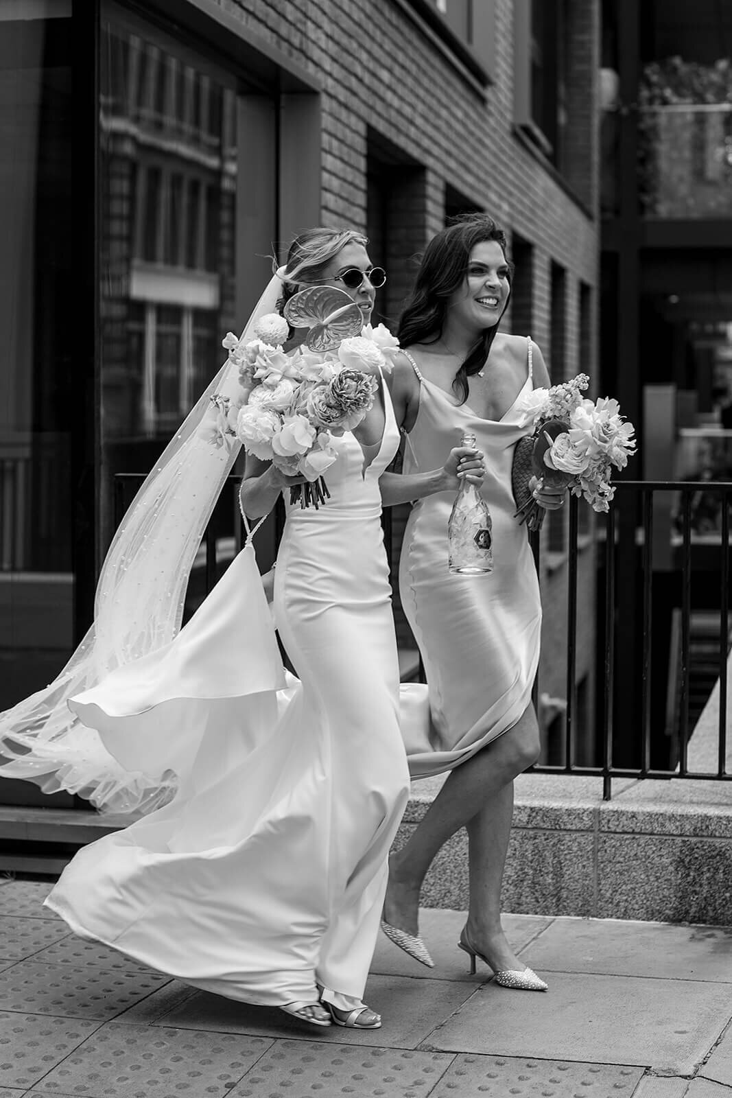 Bride and bridesmaids walking in London street