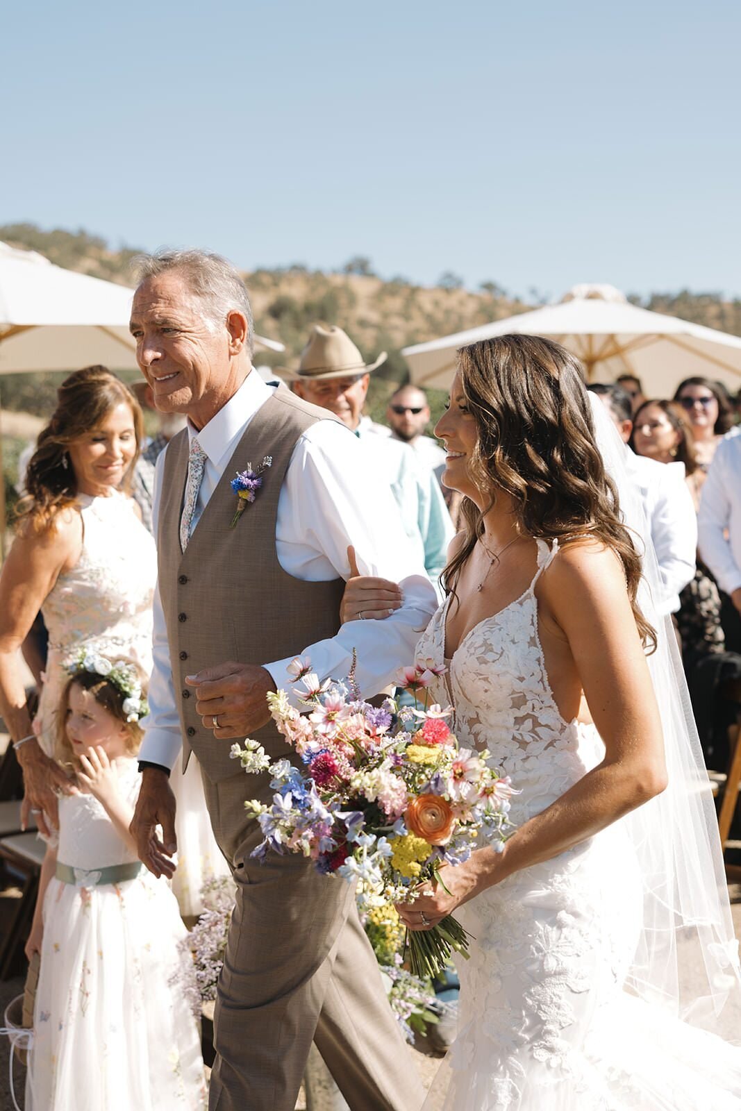 Bride's dad giving her away at the end of the aisle