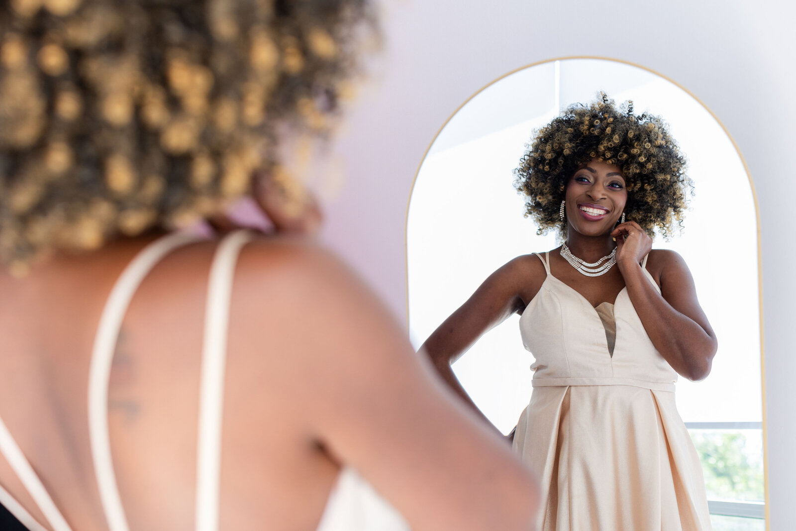 woman looking in mirror