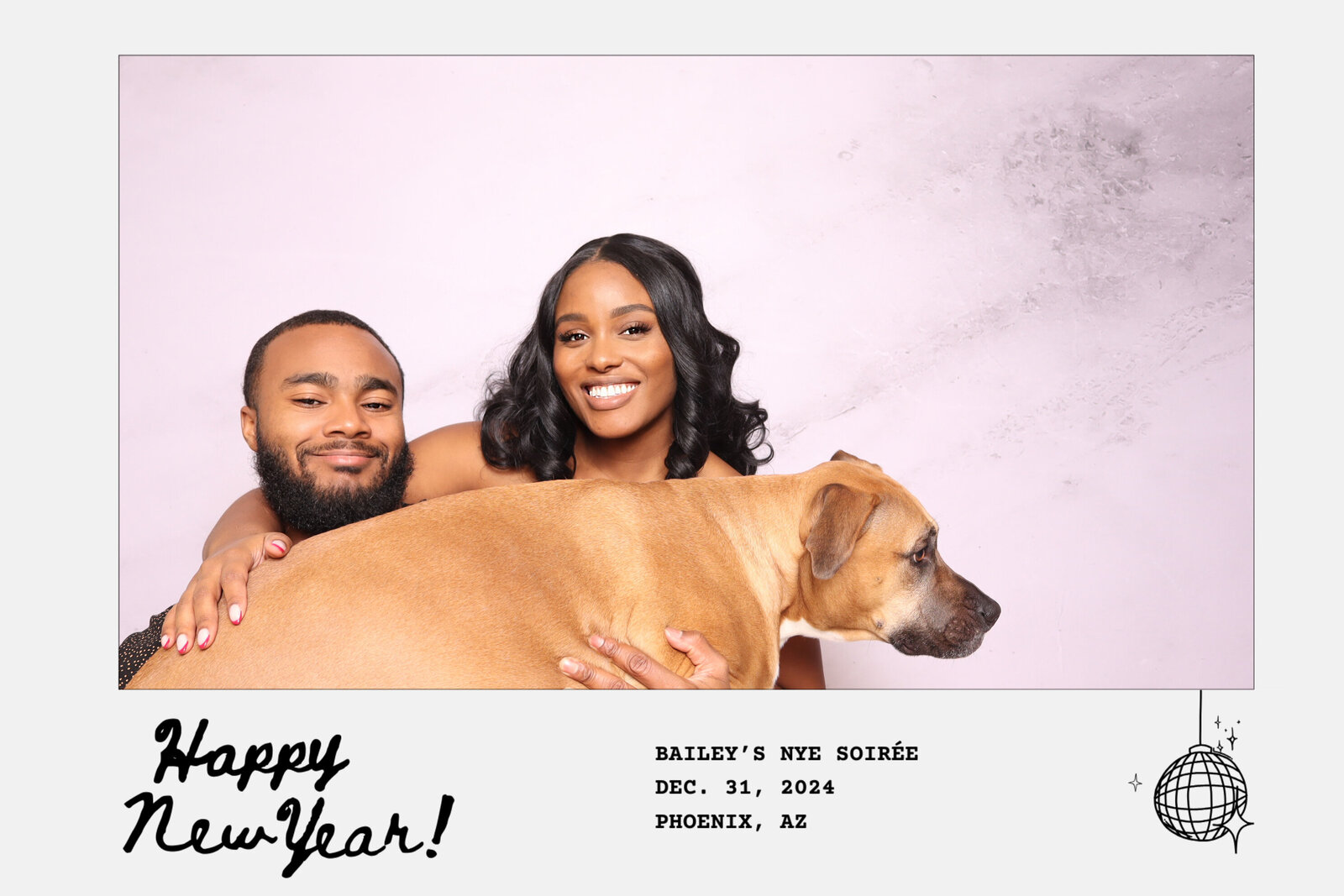 Founders of Always Present in their photo booth with their dog, portraying a personal touch.