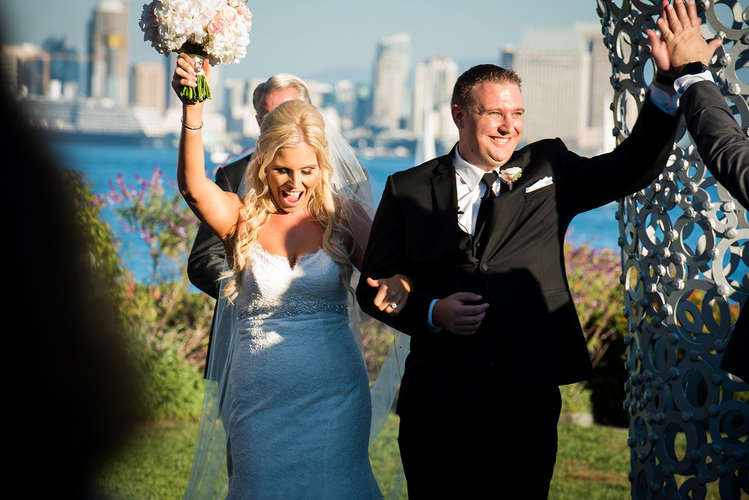 bride and groom walking down the aisle after their i do's