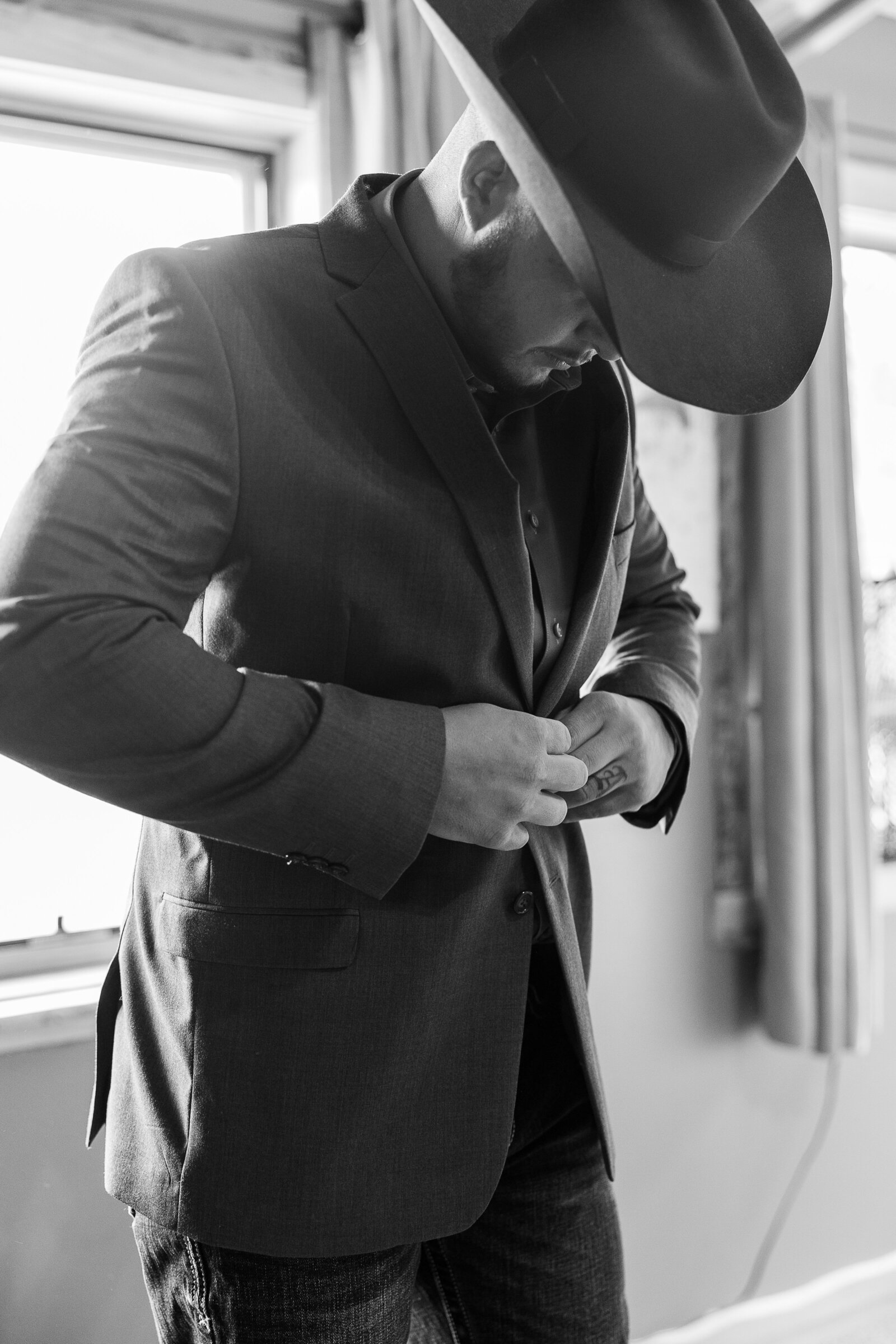 Arrowhead Lodge Wedding photo of groom preparing for his wedding day