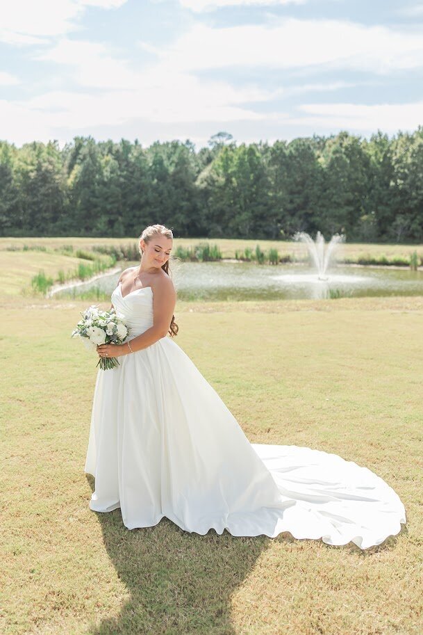 Bride-White-Wedding-Dress-Pond-Water-Fountain-The-Legacy-At-Willow-Pond