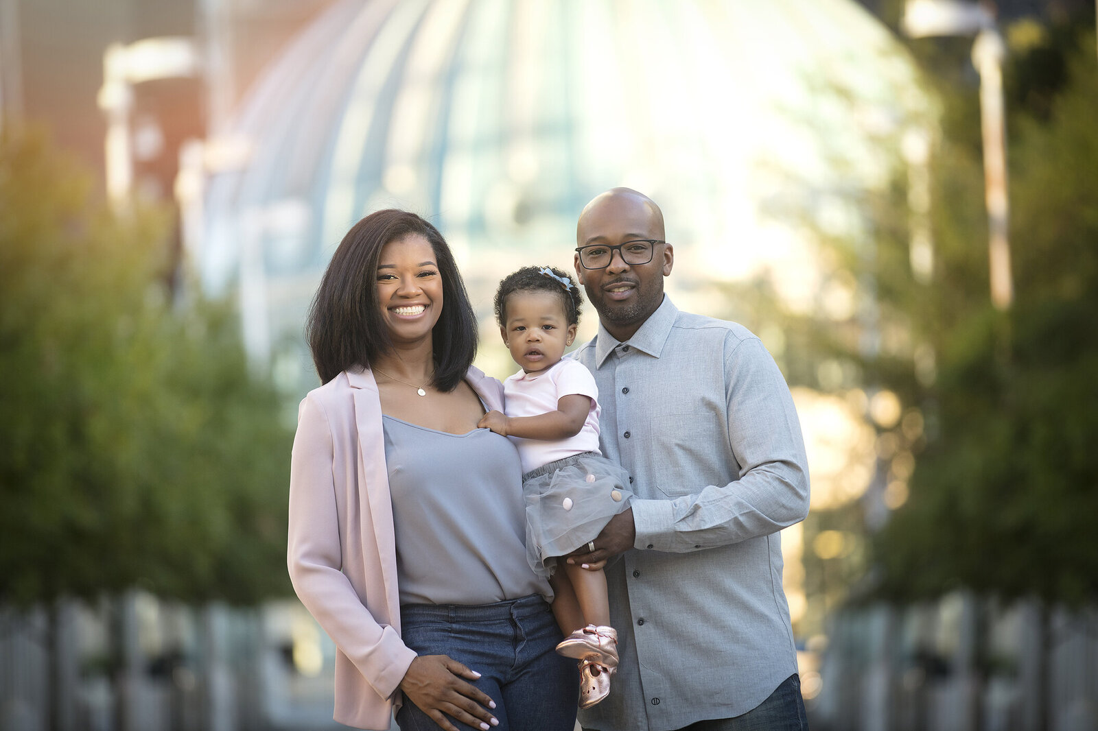 Mother and father with 1 year old girl in Dallas Arts District with Dallas Family photographer.