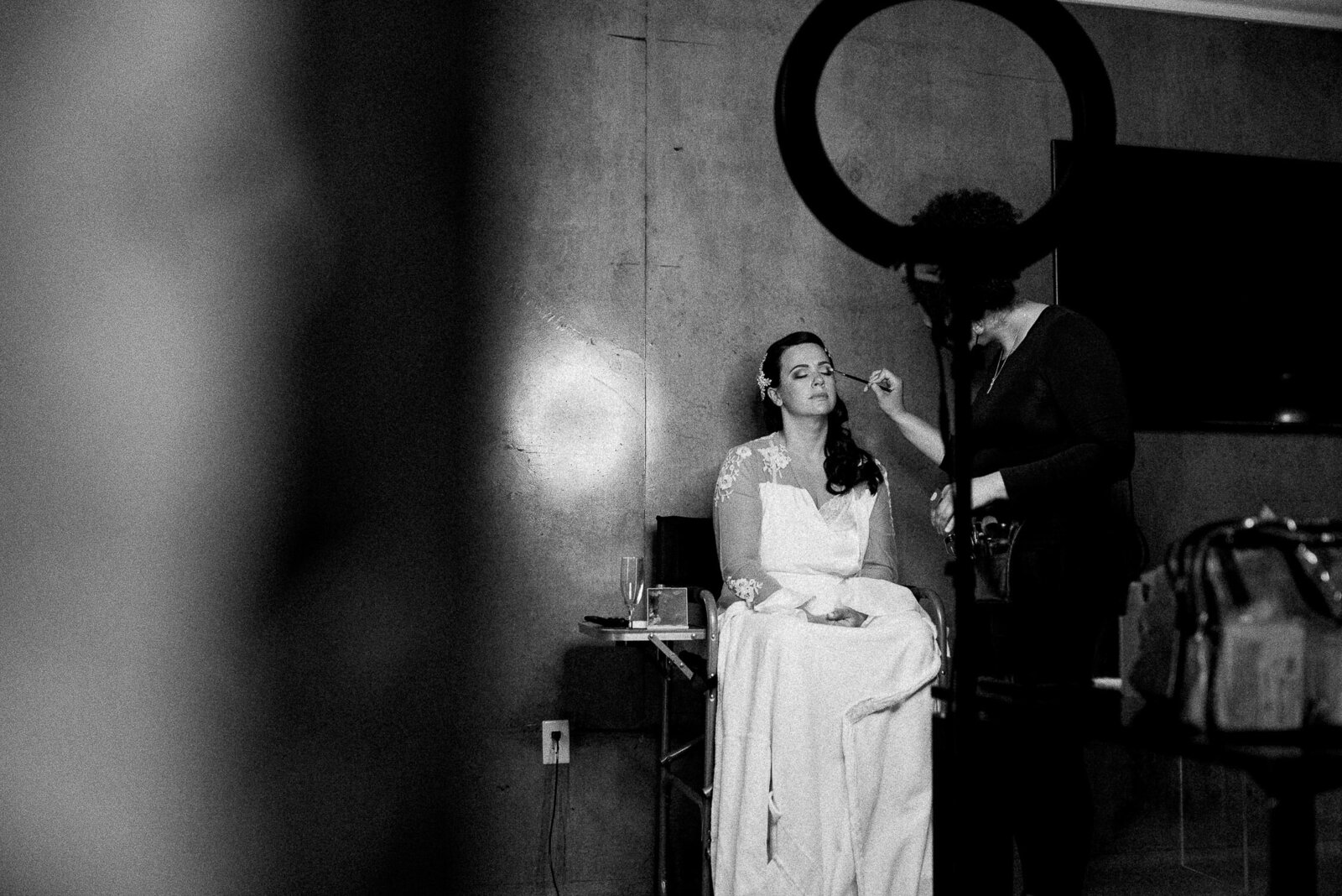 dramatic bride getting makeup done