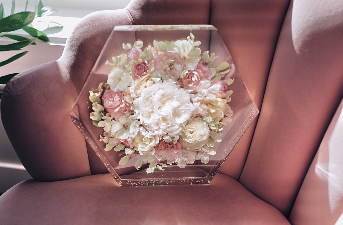 roses peonies stock and butterfly ranunculus preserved in a resin hexagon