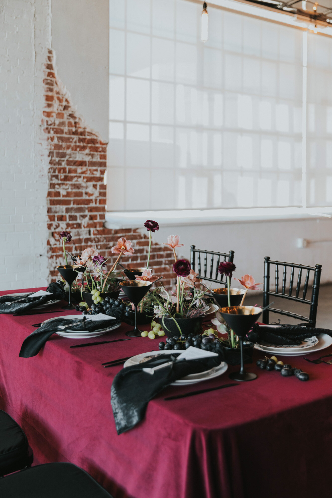 Luxurious wedding reception  with floral centerpieces and black napkins