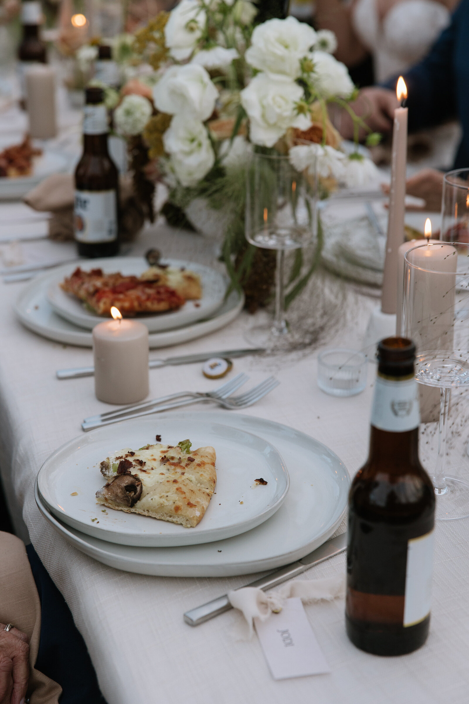 Fun pizza dinner at intimate outdoor wedding reception in Stanley, Idaho