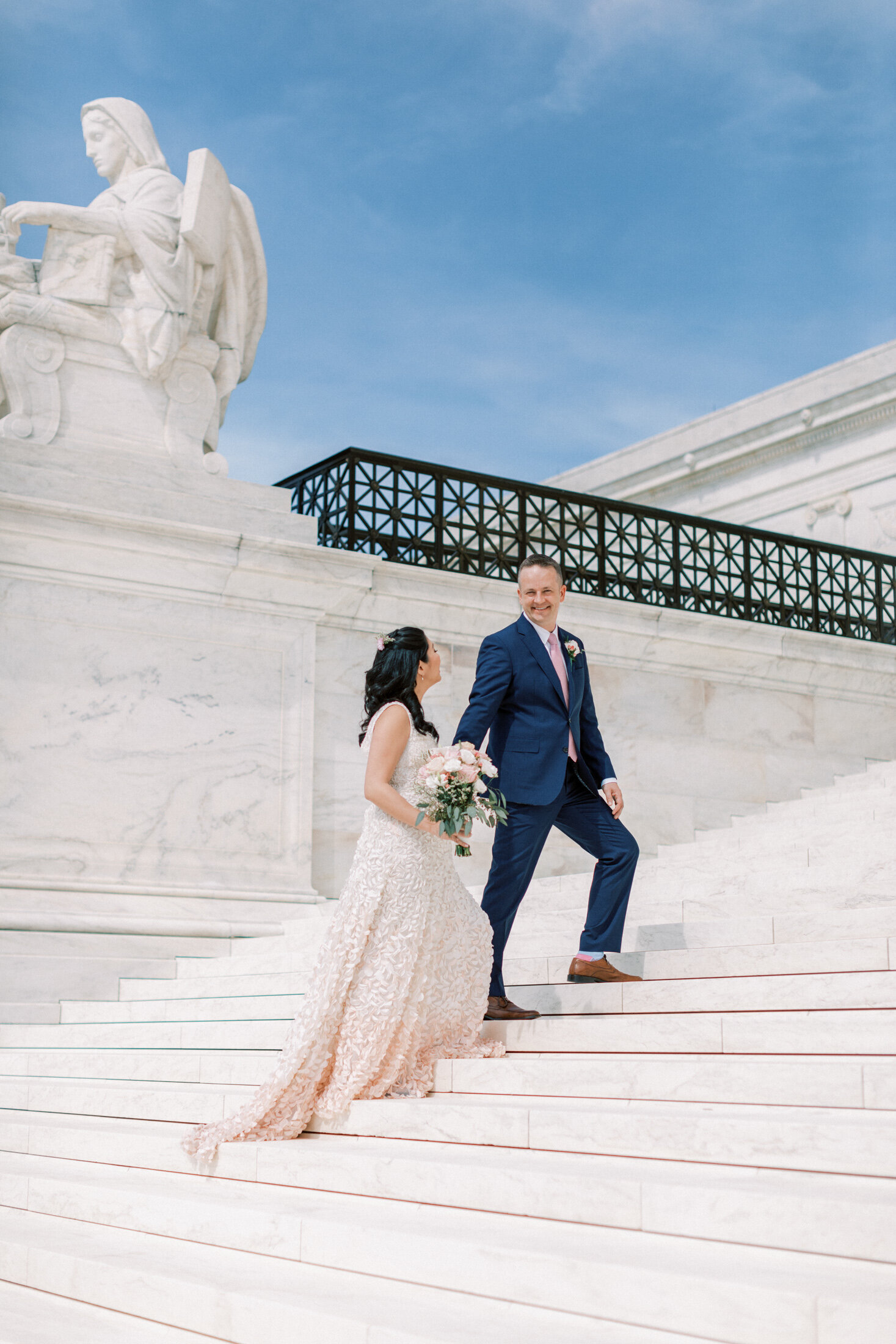 Married Couple walk up the Lincoln monument steps